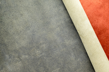 Close up fold grain grey and suede orange leather texture background,fabrics Division.