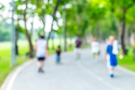 Blurred background,people running in public park,Healthy lifestyle concept.の写真素材