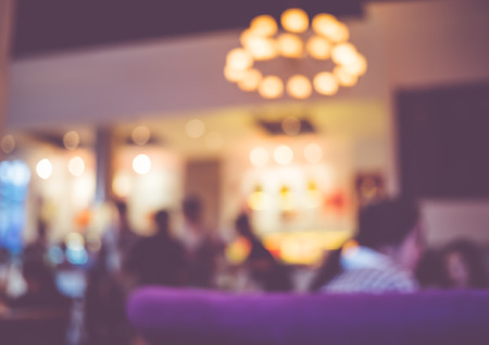 Blurred background, People chat at nightclub with bokeh light.の写真素材