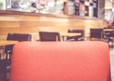 Close up red sofa at restaurant with blur background.の写真素材