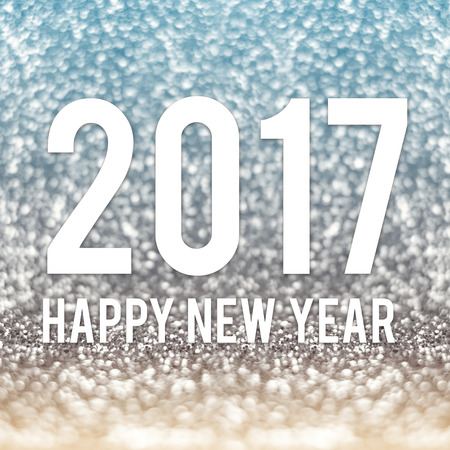 happy new year 2017 in blue and gold sparkling glitter background.