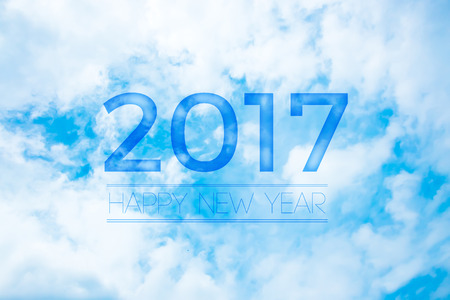 2017 Happy new year on nice blue sky with cloud,Holiday celebration greeting card.