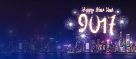 Happy new year 2017 firework over cityscape building near sea at night time celebration,mock up...