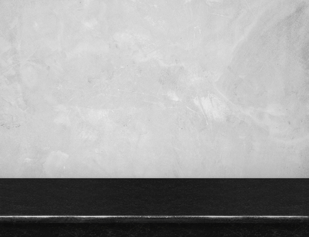 Empty black marble table top with grey concrete wall,Mock up for display or montage of product,use as background.