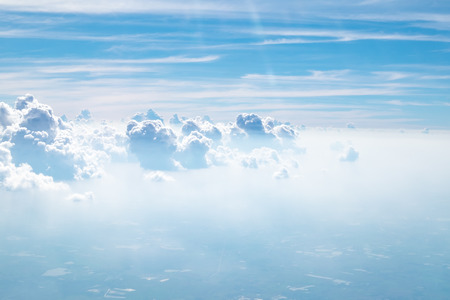 Aerial view of cloud and sky from airplane,Traveling concept.