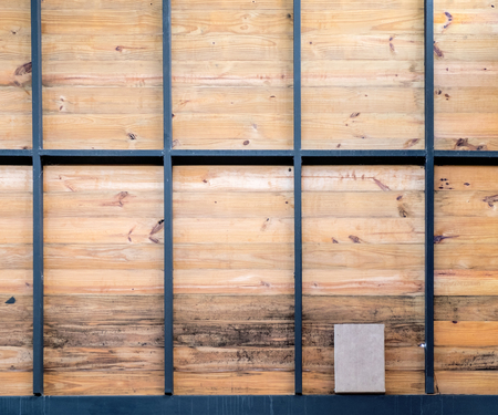 wooden wall with black steal structure.の写真素材