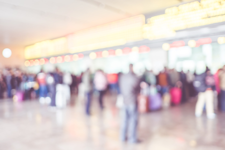 Blurred background : people queuing to buy a public transport auto ticket,Transportation concept,vintage filtered.の写真素材