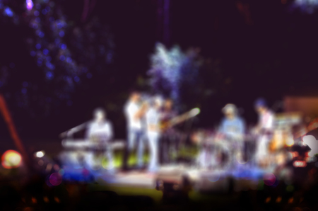 Blur background of live music at garden with bokeh light.の写真素材