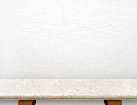 Empty cream marble table top with white concrete wall,Mock up for display or montage of product,use as background.の写真素材