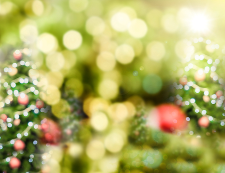 Abstract blur christmas tree background with bokeh light,Holiday backdrop,Mock up for display or montage of design.の写真素材