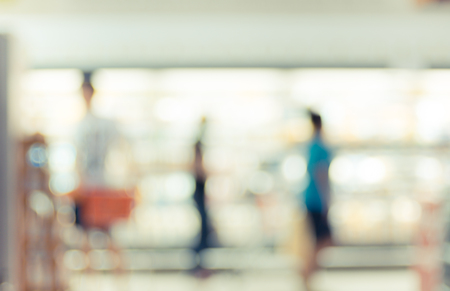 Blur background of Supermarket store product shelf with bokeh light.の写真素材