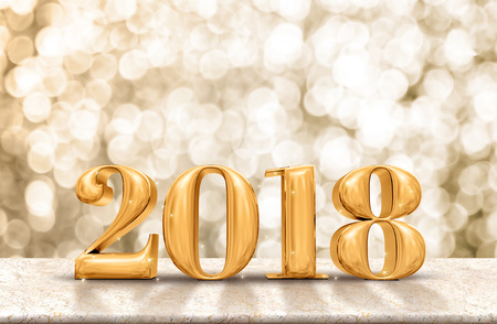 Happy New Year 2018 gold glossy on marble table with sparkling gold bokeh wall,Holiday celebration...