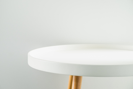 Empty modern round white table top at white house wall,Mock up space for display or montage of product.の写真素材