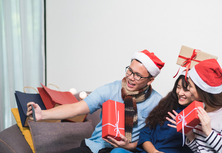 Christmas party with friends, asia woman selfie with smiling face with friends,Holiday celebration conceptの写真素材