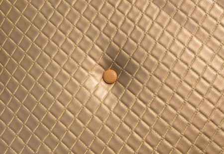 Gold vintage upholstery sofa leather texture surface background,luxury furniture backropの写真素材