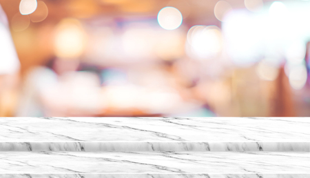 Empty step marble table top food stand with blur cafe restaurant background bokeh light,Mock up for product display or montage of design,Banner for advertise on online media,business presentationの写真素材