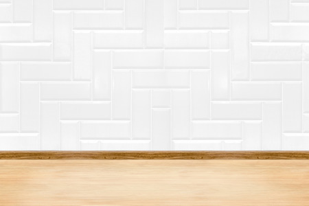 Empty white clean ceramic tile wall and wood floor background,Minimal simple style interior backdrop.の写真素材