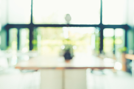 Blurred background modern kitchen and dinning room in house with bokeh light.lifestyle backdropの写真素材