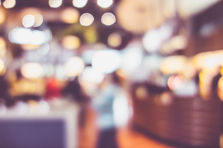 Blurred background of Customer dining at cafe restaurant blur background with bokeh light.leisure lifestyleの写真素材