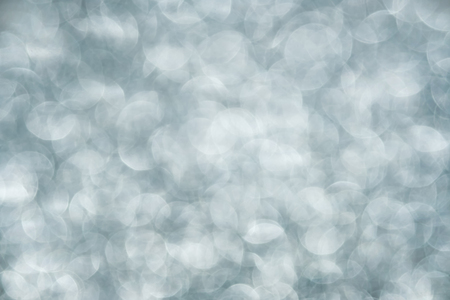 Blurred gray bokeh abstract background.use as backdrop for holiday or anniversary occasion celebrationの写真素材