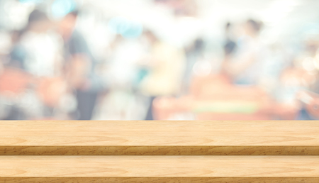 Empty step plank wood table top food stand with blur cafe restaurant background bokeh light,Mock up for product display or montage of design,Banner for advertise on online media,business presentationの写真素材