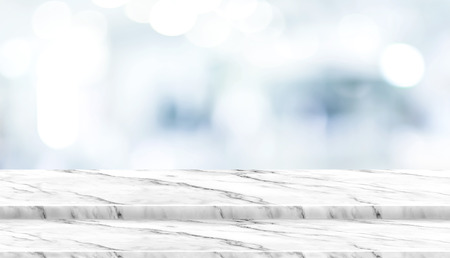 Empty step white marble table top with blur patient waiting for doctor at hospital with bokeh light at background,Mock up template for display of your design,Banner for advertise of productの写真素材