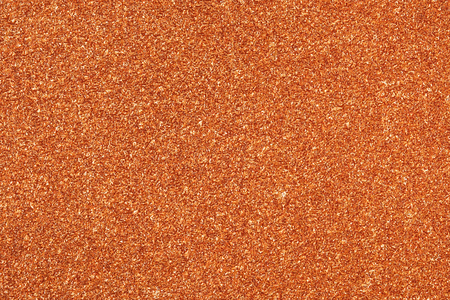 red orange sparkling glitter texture background.holiday festive backdropの写真素材