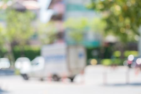 blur background of delivery product van infront of home.shipping goods e-commerce concept