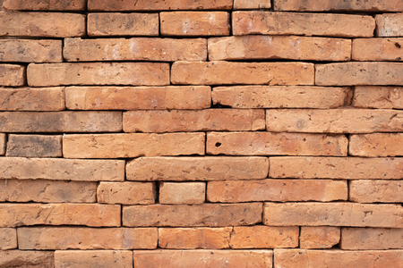 Grunge orange brick wall texture background,outdoor wallの写真素材