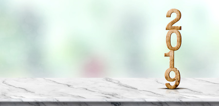 New year 2019 wood number (3d rendering) on white marble table at blur abstract green bokeh background,Mock up banner space for display or montage of product,holiday celebration greeting cardの写真素材