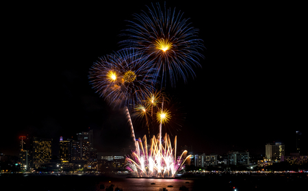 Fireworks explored over cityscape at night in sea port in Pattaya.Holiday festive celebration backgroundの写真素材