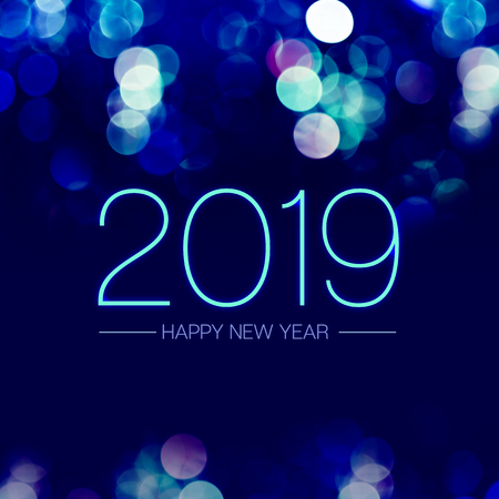 Happy new year 2019 with blue bokeh light sparkling on dark blue purple background,Holiday greeting card.の写真素材