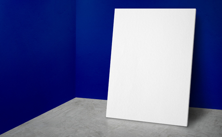 Blank poster at corner vivid blue wall and  concrete floor studio room with background,Mock up studio room for display or montage of product for advertising on media,Business presentationの写真素材