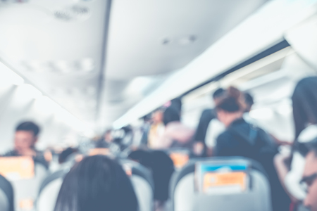 Blur background passenger on airplane cabinの写真素材
