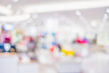 Blurred background of people shopping at department store mall with bokeh lightsの写真素材