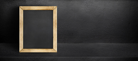 Blank blackboard leaning at black interior cement room background,banner mock up template for display of design,leave side space for adding text for advertisingのイラスト素材
