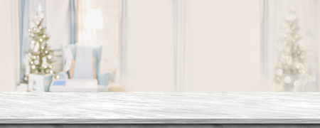 Empty grey marble table top with abstract warm living room decor with christmas tree blur background with bokeh light,Holiday backdrop,Mock up banner for display of advertise product ,luxury houseの写真素材