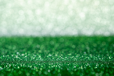Abstract green and silver sparkling bokeh wall and floor background studio.luxury holiday backdrop mock up for display of product.holiday festive greeting cardの写真素材