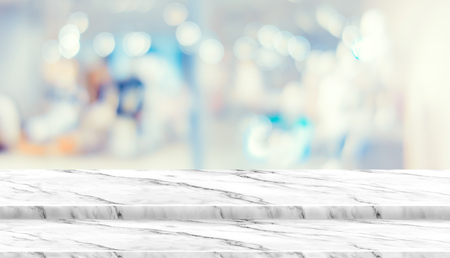Empty step marble table top food stand with blur department store background bokeh light,Mock up for display or montage of product,Banner for advertise on online media,business presentationの写真素材