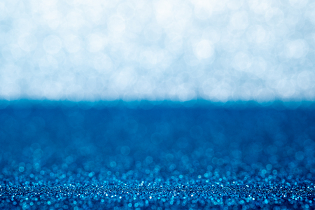 Abstract blue and silver sparkling bokeh wall and floor background studio.luxury holiday backdrop mock up for display of product.holiday festive greeting cardの写真素材