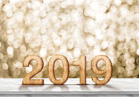 Happy new year 2019 (3d rendering) on grey marble table at gold sparkle bokeh abstract background,holiday greeting cardの写真素材