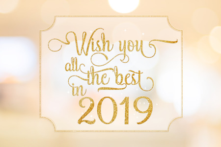 Wish you all the best in 2019 gold glitter word on white frame at abstract blurred bokeh light background, Holiday conceptの写真素材