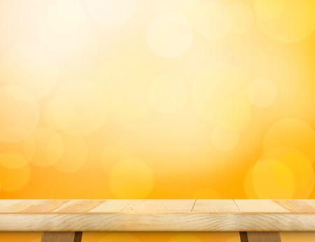 Empty wood table top (food stand) with abstract blur orange bokeh background,Autumn backgorund,Mock up for display or montage of product,banner for advertise on online.の写真素材