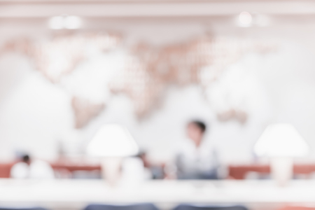 Blur background of people in business meeting room with world map on wall with bokeh lightの写真素材