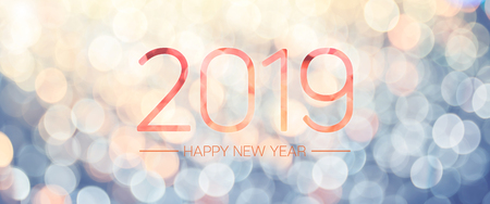 Happy new year 2019 banner with pale yellow and blue bokeh light sparkling background,Holiday greeting cardの写真素材