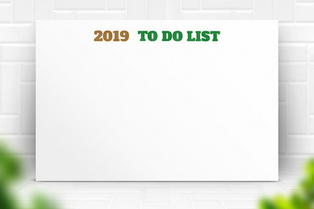 2019 new year to do list text on white paper poster and pencil with natural blur leaf foreground on white marble room wall,Business presentation mock up for adding your listの写真素材