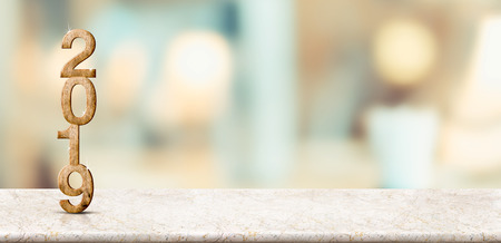 Happy new year 2019 on marble table with pale soft bokeh wall,banner for display or montage of product for holiday promotion and advertise for online content.の写真素材