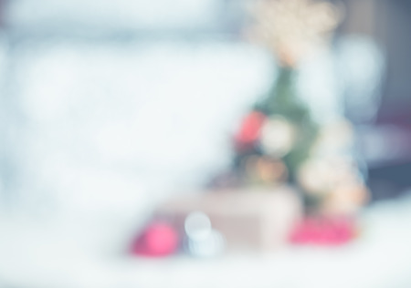 Christmas tree with light string and ball decoration at abstract blur home interior bokeh background,Backdrop for winter festive holiday celebration conceptの写真素材