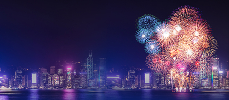 Happy new year fireworks over cityscape at night with empty white marlbe table,Banner mock up template for display or montage of product for holiday promotion advertisingの写真素材