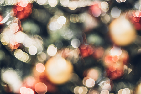 Abstract Vintage color blur decoration ball and light string on christmas tree with bokeh light background.winter holiday seasonal.の写真素材